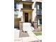 Townhouse exterior with stone accents and a wooden door at 4306 E Tyson St, Gilbert, AZ 85295