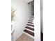 Interior staircase with dark wood and white walls at 4306 E Tyson St, Gilbert, AZ 85295