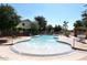 Community pool with a fun water feature and lounge chairs at 4306 E Tyson St, Gilbert, AZ 85295