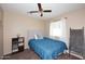 Serene bedroom with a tufted headboard and blue bedding at 4306 E Tyson St, Gilbert, AZ 85295
