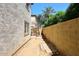 Small, sandy backyard with a brick patio area at 4306 E Tyson St, Gilbert, AZ 85295