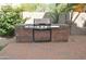 Enjoy outdoor cooking with this built-in stainless steel grill at 11239 E Oberlin Way, Scottsdale, AZ 85262