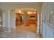 Kitchen with island, wood cabinets, and tile flooring at 11239 E Oberlin Way, Scottsdale, AZ 85262