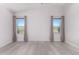 Spacious bedroom with light flooring and neutral walls at 10654 E Forge Ave, Mesa, AZ 85208