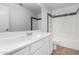 Clean bathroom with white vanity and shower/tub combo at 10654 E Forge Ave, Mesa, AZ 85208