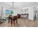 Open dining room with tile floors and views of the backyard at 10654 E Forge Ave, Mesa, AZ 85208