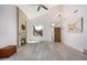 Bright living room with vaulted ceilings, fireplace, and wood-look floors at 10654 E Forge Ave, Mesa, AZ 85208