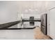 Modern kitchen with stainless steel appliances and granite countertops at 10654 E Forge Ave, Mesa, AZ 85208