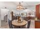 Open concept kitchen and dining area with modern cabinetry and appliances at 9302 E Broadway Rd # 2, Mesa, AZ 85208