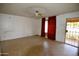Living room featuring tile flooring, red curtains, and a door to outside at 307 W Mesquite St, Chandler, AZ 85225