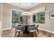 Breakfast nook with a round table, gray chairs, and sliding glass doors to a patio at 37143 N Greythorn Cir, Carefree, AZ 85377