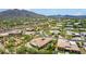 Aerial view showcasing a neighborhood of upscale homes nestled in a mountainous area at 37143 N Greythorn Cir, Carefree, AZ 85377
