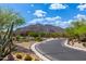 Curving road leads to a home nestled in a mountain community at 37143 N Greythorn Cir, Carefree, AZ 85377
