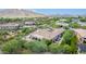 Aerial view of a home with a large backyard and pool, overlooking a scenic desert landscape at 37143 N Greythorn Cir, Carefree, AZ 85377