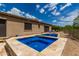 Spa and rectangular pool with tan tile deck at 37143 N Greythorn Cir, Carefree, AZ 85377
