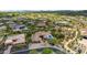 Aerial view of a luxury home with a pool in a desert setting with mountain views at 37143 N Greythorn Cir, Carefree, AZ 85377