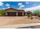 Two-car garage and front facade of a single-story house at 37143 N Greythorn Cir, Carefree, AZ 85377