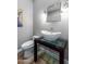 Modern bathroom with a free-standing vessel sink, glass shelf, and a toilet at 37143 N Greythorn Cir, Carefree, AZ 85377