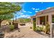 Landscaped backyard with fire pit, cacti, and mountain views at 37143 N Greythorn Cir, Carefree, AZ 85377