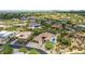 Aerial view showing a community of luxury homes with pools and desert landscaping at 37143 N Greythorn Cir, Carefree, AZ 85377