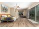 Main bedroom with sliding doors to a patio, large bed, and a workspace at 37143 N Greythorn Cir, Carefree, AZ 85377