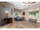 Bright bedroom with wood-look floors and a ceiling fan at 37143 N Greythorn Cir, Carefree, AZ 85377