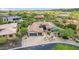 Aerial view of a house with a pool and landscaped yard in a desert setting at 37143 N Greythorn Cir, Carefree, AZ 85377