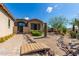 Landscaped yard with a wooden footbridge and desert plants at 37143 N Greythorn Cir, Carefree, AZ 85377