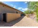 Landscaped side yard with gravel, a fence, and a gated access at 37143 N Greythorn Cir, Carefree, AZ 85377