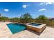 Rectangular pool and hot tub with mountain views at 37143 N Greythorn Cir, Carefree, AZ 85377