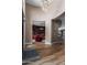 Elegant entryway with wood floors, a chandelier, and views into a library with built-in bookshelves at 37143 N Greythorn Cir, Carefree, AZ 85377