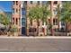 Three-story brick building with gated entry and landscaping at 2017 N 1St Ave, Phoenix, AZ 85003