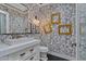 Chic bathroom with a rabbit wallpaper, white vanity, and gold accents at 2017 N 1St Ave, Phoenix, AZ 85003