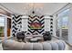 Chic living room with a statement wall, large windows, and a curved sofa at 2017 N 1St Ave, Phoenix, AZ 85003