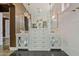 Spa-like bathroom with double vanities, marble tile, and crystal chandeliers at 2017 N 1St Ave, Phoenix, AZ 85003