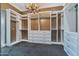 Spacious walk-in closet with custom built-ins and chandelier at 2017 N 1St Ave, Phoenix, AZ 85003