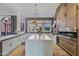 Modern kitchen with white cabinetry and exposed brick wall at 2017 N 1St Ave, Phoenix, AZ 85003