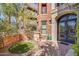 Side entrance with lush landscaping and brick accents at 2017 N 1St Ave, Phoenix, AZ 85003