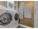Laundry room with front-load washer and dryer, and built-in shelving at 2017 N 1St Ave, Phoenix, AZ 85003