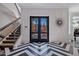 Elegant entryway with black and white floor and double doors at 2017 N 1St Ave, Phoenix, AZ 85003