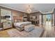 Opulent bedroom with a tufted headboard, wood floors, and large windows at 2017 N 1St Ave, Phoenix, AZ 85003