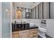 Modern bathroom with black countertops, a unique sink, and stylish wallpaper at 2017 N 1St Ave, Phoenix, AZ 85003