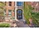 Grand entrance with iron doors and lush greenery at 2017 N 1St Ave, Phoenix, AZ 85003