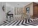 Elegant piano room features a black and white chevron floor and built-in shelving at 2017 N 1St Ave, Phoenix, AZ 85003
