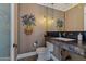 Stylish powder room with unique art and dark vanity at 2017 N 1St Ave, Phoenix, AZ 85003