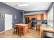 Kitchen features an island, stainless steel appliances, and wood cabinetry at 29804 N Desert Willow Blvd, San Tan Valley, AZ 85143