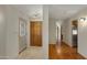 Entryway with wood floors, coat closet, and front door at 10860 E Cactus View Cir, Gold Canyon, AZ 85118