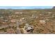 Aerial view of a house with solar panels and desert landscape at 10860 E Cactus View Cir, Gold Canyon, AZ 85118