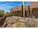 View of the home's exterior, landscaping, and surrounding desert at 10860 E Cactus View Cir, Gold Canyon, AZ 85118