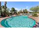 Relaxing kidney-shaped pool with brick decking and stunning views of the property's landscaping at 56444 N Vulture Mine Rd, Wickenburg, AZ 85390